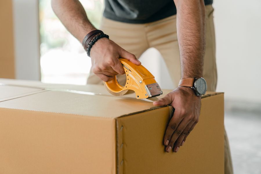 Bueno Moving Service crew carefully loading a moving truck